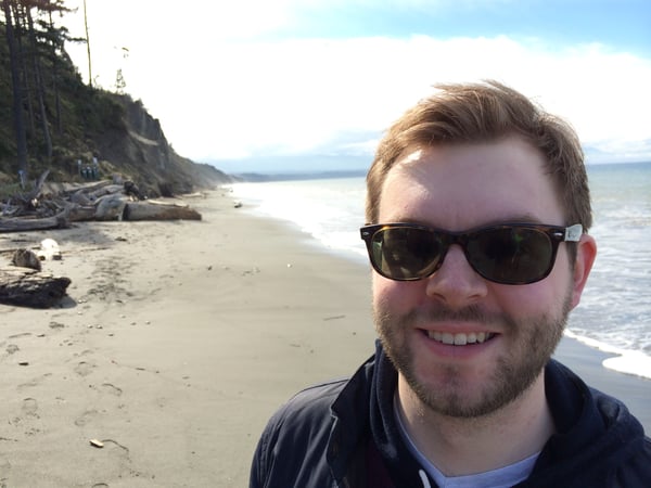 Headshot photo of Textio's Frazier Monk at a beach